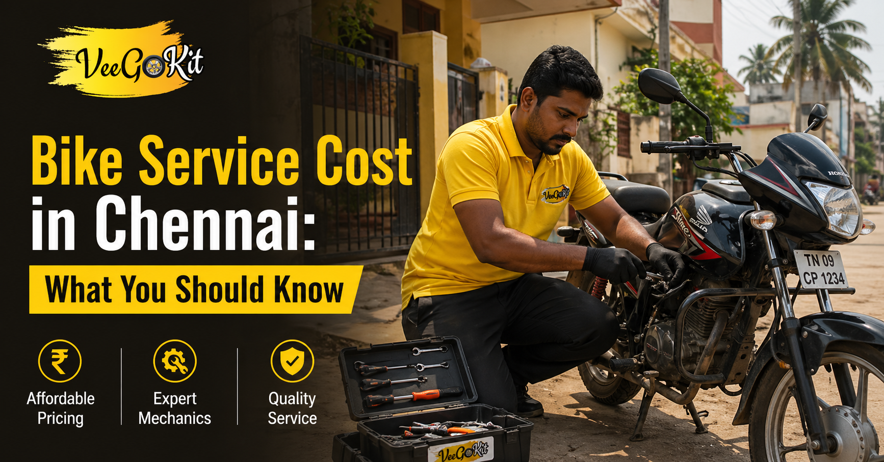 mechanic in yellow t-shirt servicing a bike at home in Chennai